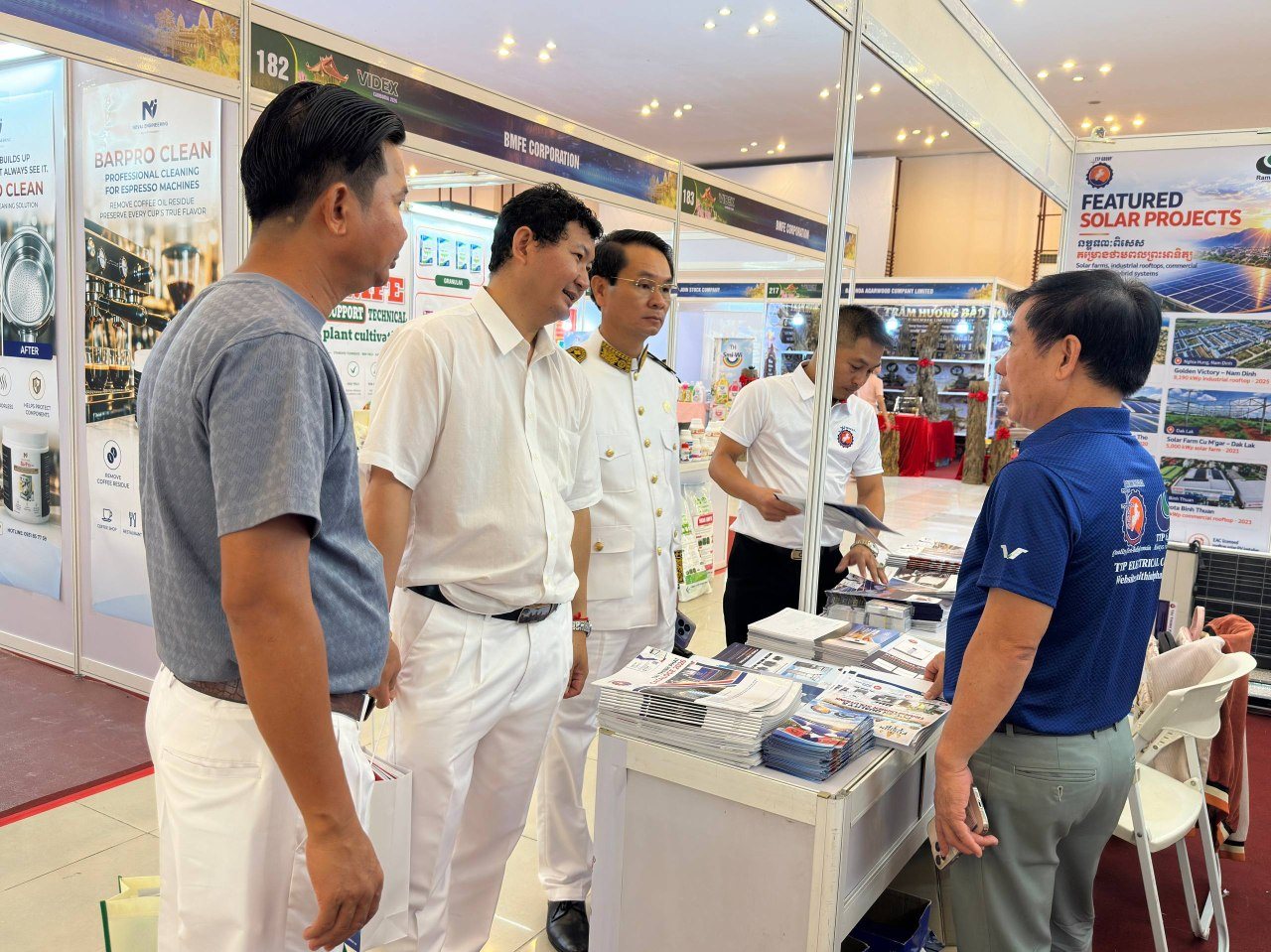 Visitors exploring product catalogues at the TTP Group booth.